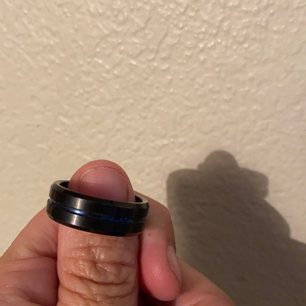 A man’s ring with Thin blue line A black around it